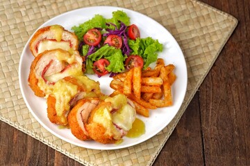 Cordon bleu or schnitzel cordon bleu is a meat dish wrapped in cheese.