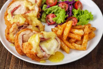 Cordon bleu or schnitzel cordon bleu is a meat dish wrapped in cheese.