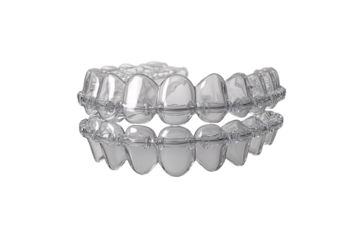 Clear plastic dental aligners showing upper and lower teeth straightening trays, isolated on a transparent background