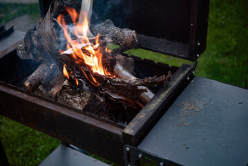 firewood in the metal bbq grill