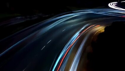 Nighttime light trails of moving cars on a busy highway  