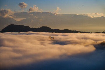 St.Thomas church in morning fog near Skofja Loka in Slovenia