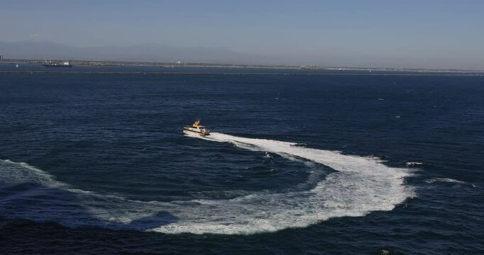 Long Beach California pilot boat return to port. Long Beach container port Los Angeles. Major gateway for US, Asian and China trade. Over $100 billion per year in trade.