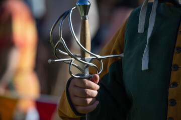 Medieval knight armor with helmet, sword, axe, and chainmail on display at historical reenactment...