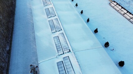 Snow-covered solar panels in winter landscape