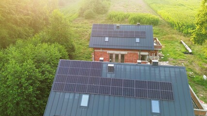 House with solar panels surrounded by nature