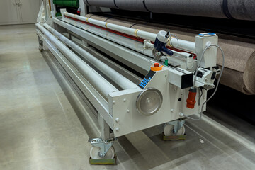 Machine for cutting carpets and linoleum.