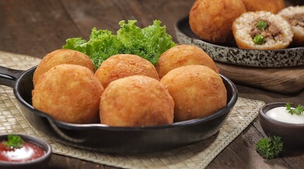 Arancini, a snack made from a mixture of rice, breadcrumbs and eggs. Filled with minced meat and mozzarella cheese.