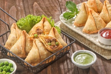 Samosa or samboosa is a triangular fried pastry filled with boiled potatoes seasoned with spices...