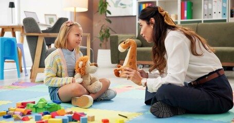 Therapy, woman and girl with toys, talk and listen with guide for emotional assessment on floor....