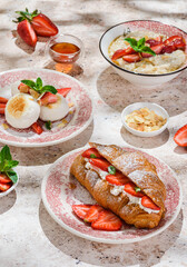 croissant with strawberries and mascarpone and cheesecakes with strawberries