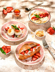 croissant with strawberries and mascarpone and cheesecakes with strawberries