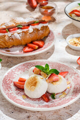 cottage cheese cheesecakes with strawberries, croissant with strawberries and mascarpone 