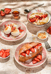 croissant with strawberries and mascarpone and cheesecakes with strawberries