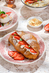 croissant with strawberries and mascarpone and cheesecakes with strawberries