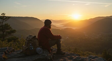 Obraz premium Bearded hiker meditates overlooking valley landscape at sunset mountain scenery adventure backdrop