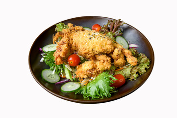 Fototapeta premium Crispy deep-fried soft shell crab salad with vegetables on ceramic plate