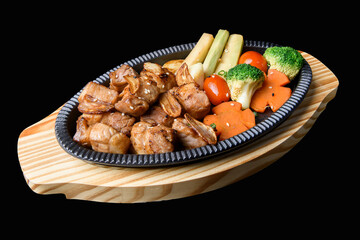 Garlic pork stir fry with vegetables on Japanese sizzling plate