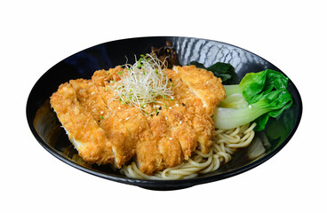 Tonkatsu ramen with fried pork cutlet and vegetables in black bowl