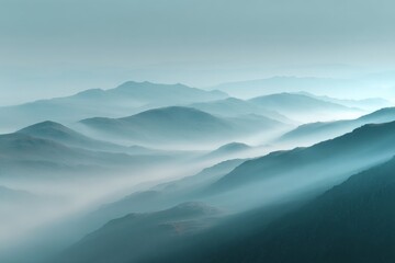 Fototapeta premium Misty mountain landscape during early morning captures serene beauty and tranquil atmosphere