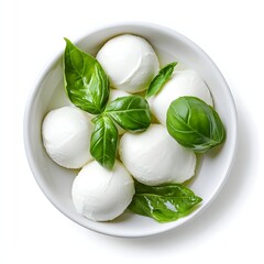 Fresh mozzarella balls in ceramic bowl with basil leaves