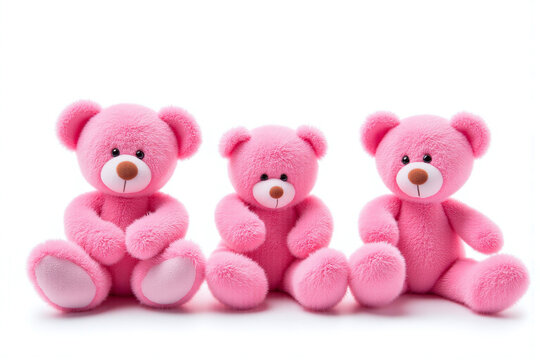 three pink teddy bears sitting next to each other on a white background