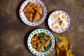 Urap with boiled eggs and fried tempeh 