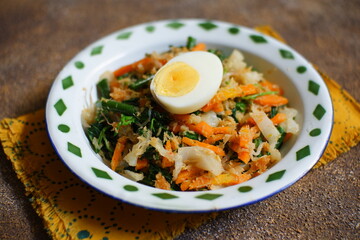 Vegetable with coconut grated seasoning named urap sayur in Bahasa 