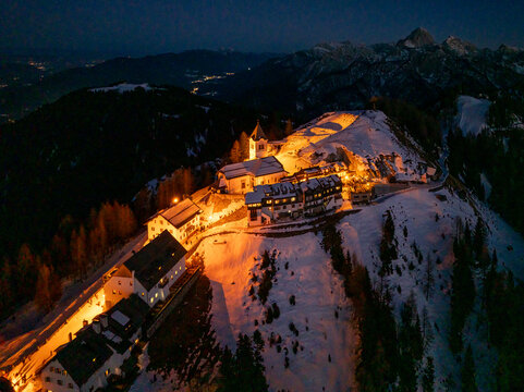 Night view of Monte Santo di Lussari, Italy. The Di Prampero slope in Camporosso welcomed the new year with the longest torchlight procession in the entire Alpine arc.