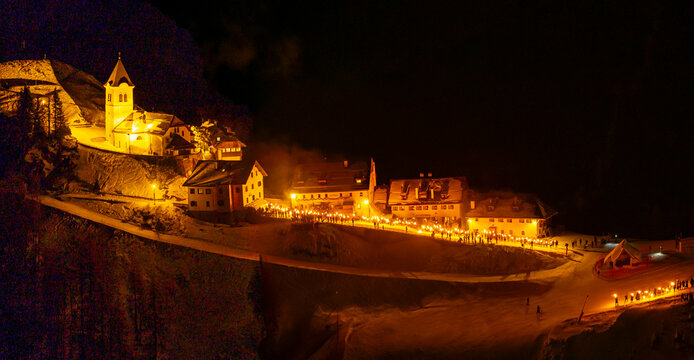 Night view of Monte Santo di Lussari, Italy. The Di Prampero slope in Camporosso welcomed the new year with the longest torchlight procession in the entire Alpine arc.