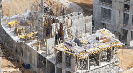 A construction site with scaffolding and a lot of debris