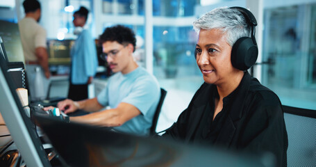 Office, businesswoman and headphones with computer for web development, coding and listening to music. Coworking, night and mature developer with digital for programming, software update and podcast