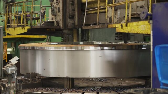 Large industrial lathe rotating and machining steel ring. Stock clip