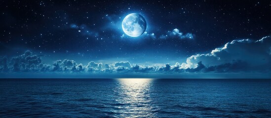 A beautiful nighttime ocean scene with bright moon and stars