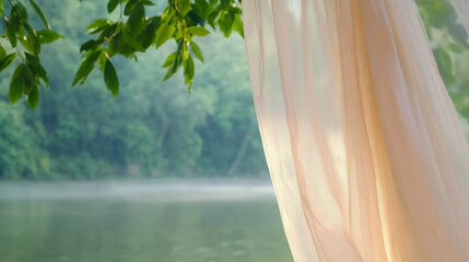 Minimalist mosquito net hanging over a serene lake surrounded by trees  