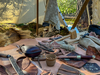 A saddler's workshop, a stand showing the production of leather goods using old methods