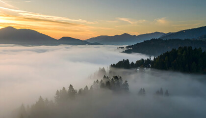 Fototapeta premium Aerial View of Misty Mountain Landscape at Sunrise