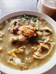 Close-up of a bowl of savory noodle soup.