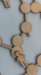 Wooden human figures connected by circles representing networking concept.