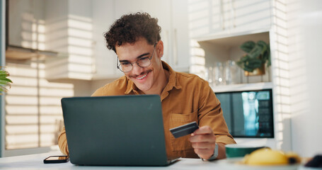 Man, credit card and happy with laptop in home for online shopping, cart checkout and rewards...