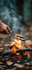 Fototapeta premium Grilling fresh fish over campfire outdoor nature food photography