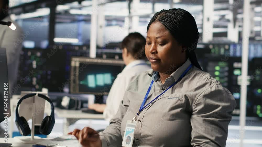 Poster woman in data center doing software updates, verifying machine learning parameters. server farm it e