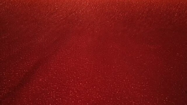 Vibrant ruby red glitter texture background with sparkling effect