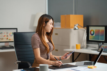 Designer woman thinking ideas strategy about mobile app interface wireframe design with customer...