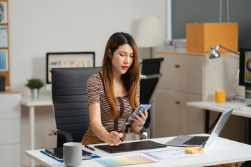 Designer woman thinking ideas strategy about mobile app interface wireframe design with customer...