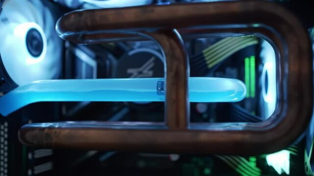 This engaging display features a custom gaming PC build with an intricate cooling system. Bright LED lighting adds a modern touch to the design, enhancing the overall aesthetic.
