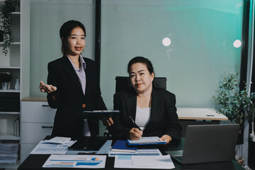 Teamwork with business people analysis cost graph on desk at meeting room. double exposure successful teamwork,business planning concept.