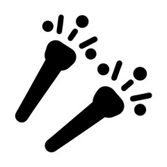 Two handheld party noisemakers or party poppers in black silhouette