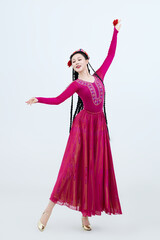 Beautiful dancers performing traditional Uyghur dance from Xinjiang, China