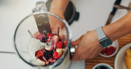 Fruit smoothie, hands and person with blender for breakfast shake, meal replacement and organic drink. Above, nutrition and preparation in kitchen for weight loss beverage, protein diet and wellness